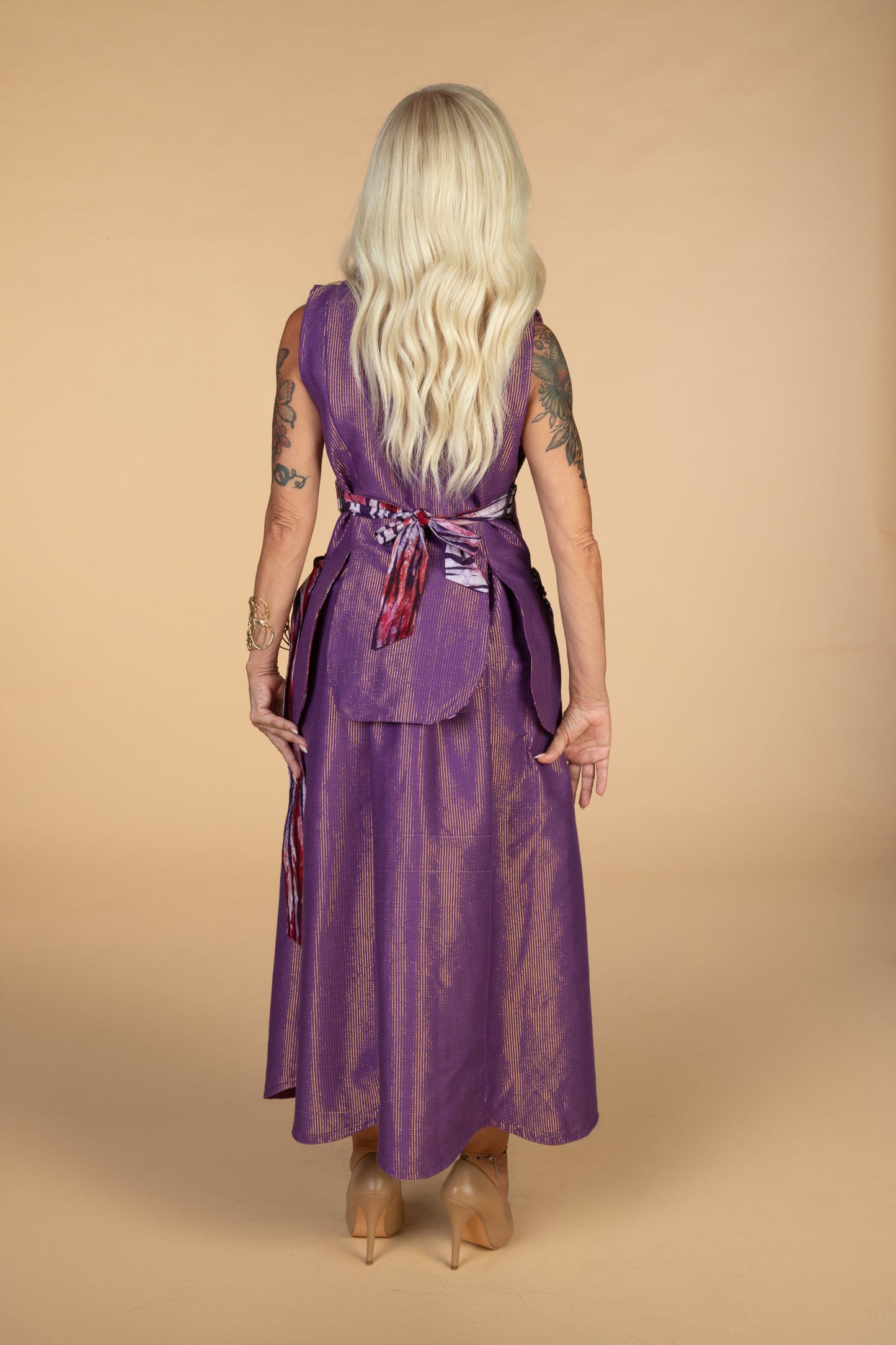 “Jess Gt” ( purple sleeveless vest with adjustable belts)